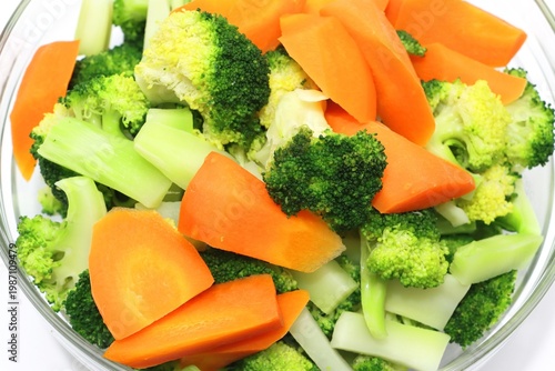 Boiled broccoli and carrots closeup food background