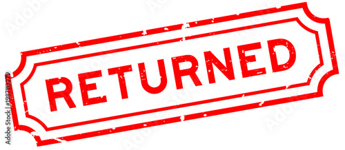 Grunge red returned word rubber seal stamp on white background