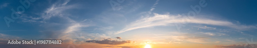 Majestic Panoramic Sunset Sky with Wispy Cirrus Clouds over a Golden Horizon