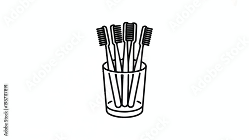 toothbrushes in a glass cup on a white background
