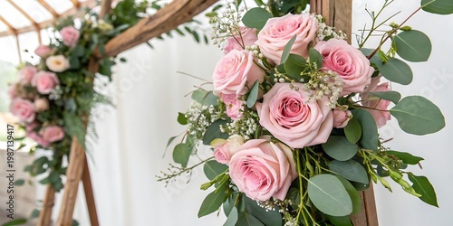 Wedding arch decorated with lush pink rose bouquets pink roses floral decoration