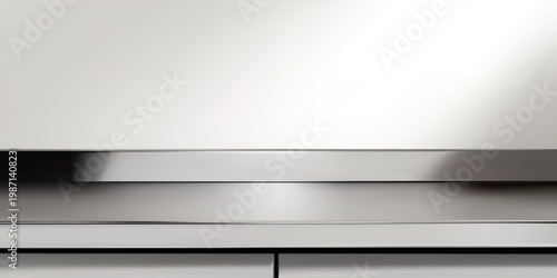 Stainless steel kitchen pedestal table on light background. Minimal industrial surface with reflective metal texture. Modern display counter for product presentation and mockup.