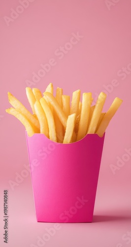 Vibrant French Fries in Pink Container on Matching Background.