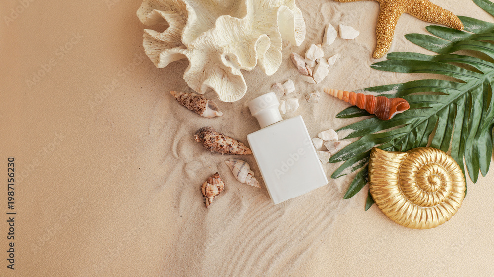 Naklejka premium White perfume bottle surrounded by seashells and tropical leaves on sand
