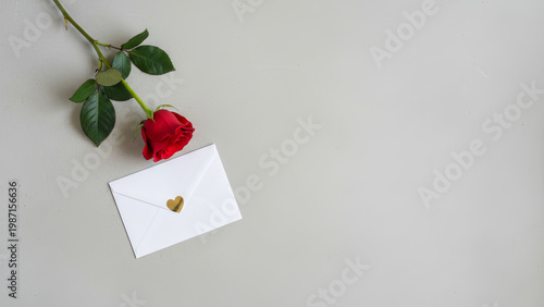 Red Rose With White Envelope and Gold Heart Sticker Romantic Love Letter Flatlay on Neutral Background