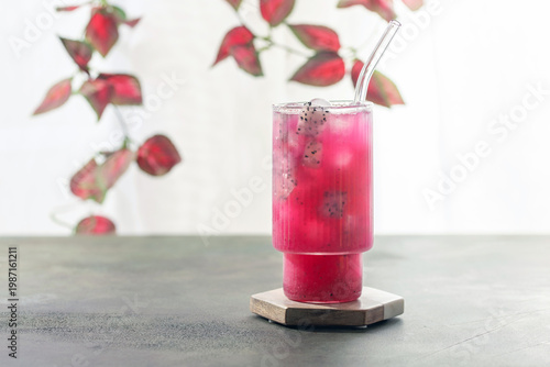 Refreshing Dragon Fruit Cocktail in glass on the table. White background