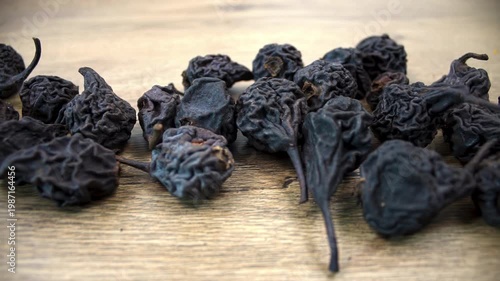 Pyrus communis: Row of Dried Pears on Wood Background. Movement Over Dried Fruit Group