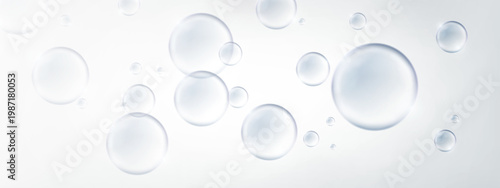 Transparent bubbles floating on soft light background abstract design. Abstract composition of transparent floating bubbles on a soft light gradient background