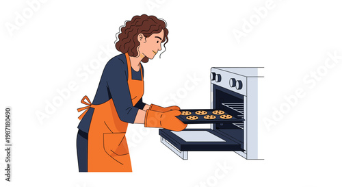 A woman with curly brown hair wearing an orange apron uses thermal gloves to slide a tray of freshly baked cookies into a modern oven in the kitchen.