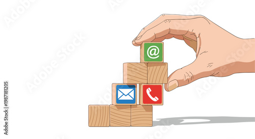 Human hand meticulously positioning a wooden block marked with an email symbol onto a tiered structure featuring contact icons in a bright environment.