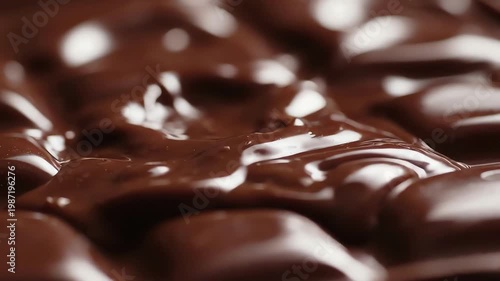 Macro Close Up of Melting Dark Chocolate Bar Surface with Bubbling Texture