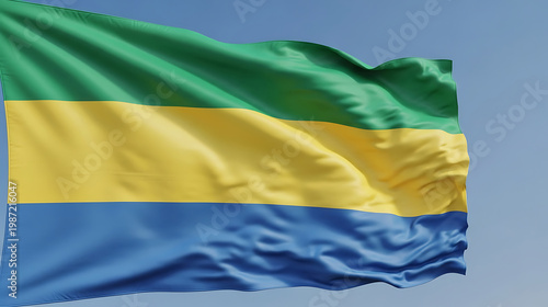Gabon national flag waving majestically in the wind against a blue sky