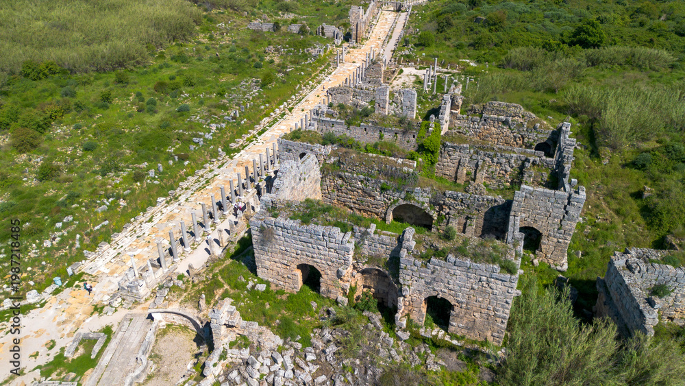 Naklejka premium Aerial Panoramic View of the Column-Lined Street and Ancient Roman Ruins in Perge, Antalya, Turkey