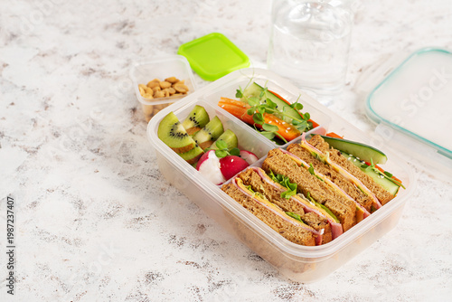 Healthy lifestyle concept with lunchbox and water bottle