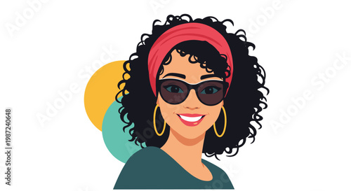 Stylish young woman with dark curly hair wearing sunglasses a headband and large hoop earrings smiling at the camera.