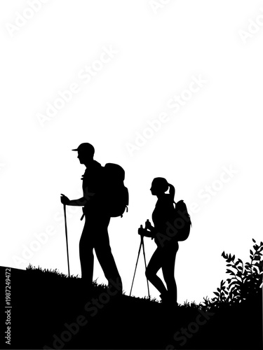 Silhouette of couple hiking on a hill with walking sticks and backpacks