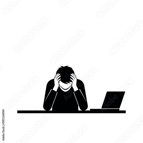 Silhouette of a stressed person holding head in hands at a desk with laptop.