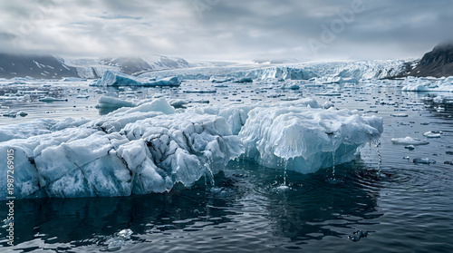 Dramatic icebergs in a cold ocean landscape under a cloudy sky