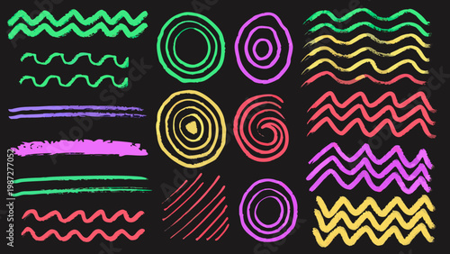 Colorful chalk scribbles and shapes arranged on a black background