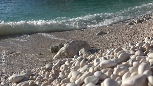 Kas, Turkey - 24 of February 2026: White pebbles and sea waves on Buyukcakil beach
