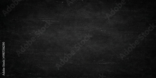 Dark vintage black chalkboard background texture with chalk dust scratches and grunge empty board wallpaper