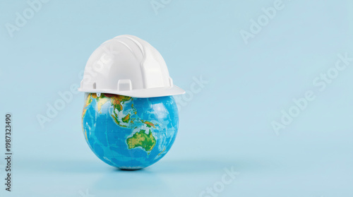 Earth Day sustainability concept with construction safety helmet on globe, responsible infrastructure development, green building industry, climate conscious engineering and sustainable future plannin
