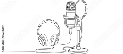 Microphone and headphones for recording, podcasting setup, audio equipment, sound production, broadcasting, music creation, studio gear, performance tool.