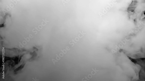 Ethereal white smoke swirling and drifting against a dark background