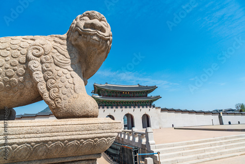 Seoul, South Korea - Apr. 12, 2026 : Haetae Statue and Gwanghwamun Gate under Blue Sky, Seoul, South Korea