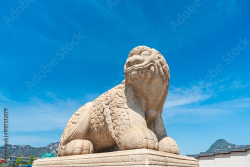 Seoul, South Korea - Apr. 12, 2026 : Haetae Statue and Gwanghwamun Gate under Blue Sky, Seoul, South Korea