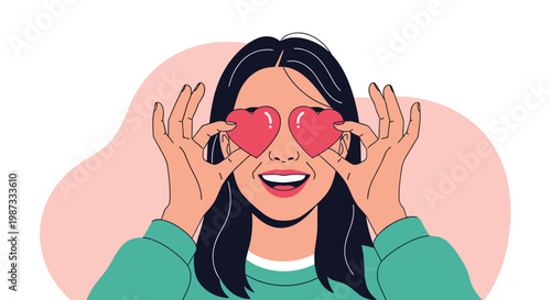 Happy young woman holding red heart shapes over her eyes and smiling with joy for love and romantic feelings.