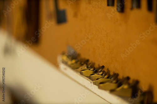 Carpentry tools in wooden rack close up workshop detail