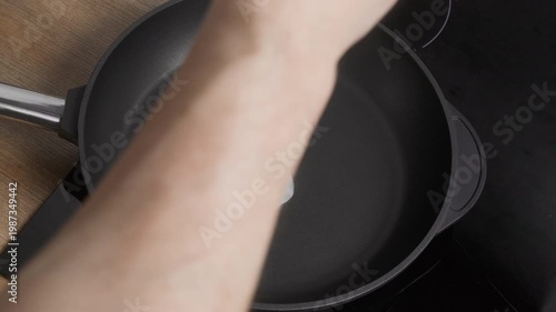 Egg Crack Hot Pan. Preparing Simple Breakfast By Cracking Egg Into Heated Skillet On Induction Stove