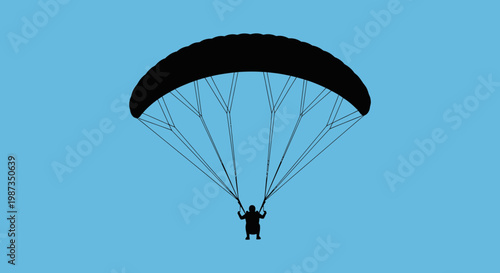 Silhouette Of Person Paragliding Against Clear Blue Sky