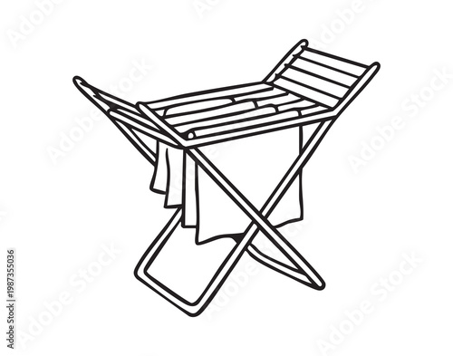 Folding drying rack with towels hanging, minimalist indoor laundry scene showing compact metal rack near window, soft cotton towels draping, warm sunlight casting gentle shadows, organized tidy