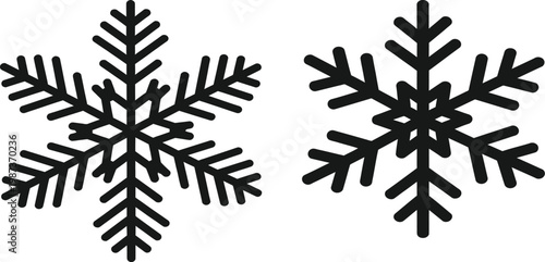 Two intricate black snowflake illustrations on a clean white background winter symbolism