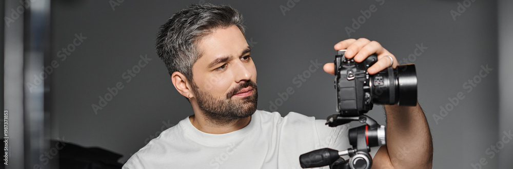 © LIGHTFIELD STUDIOS - Creative man capturing moments with camera in a modern studio setting
