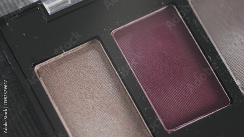 Sophisticated twopan eyeshadow in velvety tones. Detailed shot showcasing velvety texture and fine shimmer of cosmetic compact in studio lighting