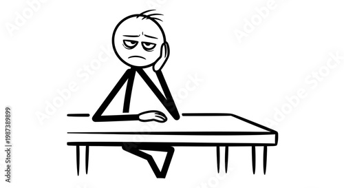 A bored man sitting at a table.