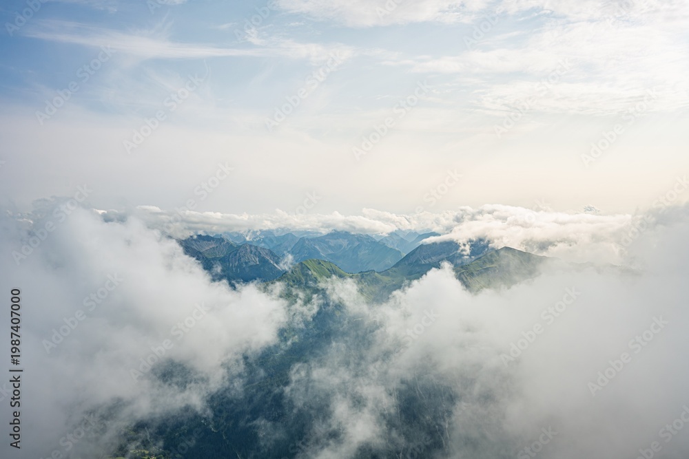 Naklejka premium View from Thaneller Summit towards Galtjoch and Kelmer Spitze, Green Mountain Peaks Rising Above a Sea of Clouds, Atmospheric Alpine Landscape, Lechtal Alps, Tyrol, Austria, Europe
