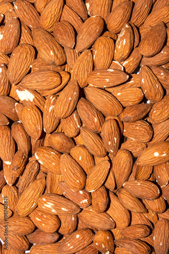 Almonds and peeled nuts.Almonds are edible seed kernels or the seeds of the plant of the same name from the Almond subgenus of the Plum genus.Almonds are common.