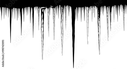 Black paint drips falling down on white background creating abstract streaks and texture