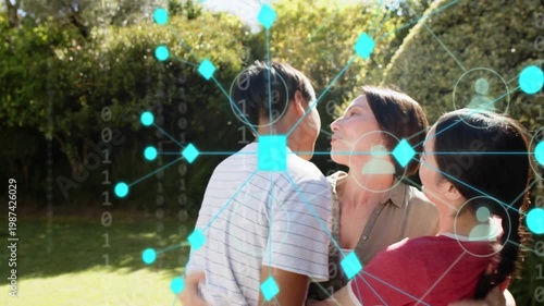 Opening arms, mother hugging adult children showing love in backyard while teal overlay growing