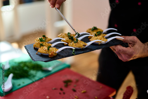 Risotto. Chef preparing small tapas for a risotto tasting at a restaurant