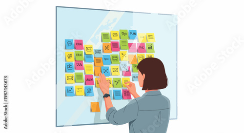 A focused businesswoman arranging colorful sticky notes on a large glass board in a modern office setting with a thoughtful expression.