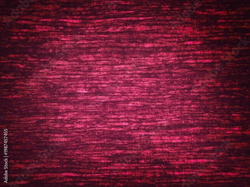 Abstract textured fuchsia pink background with horizontal fibers and dark vignette border