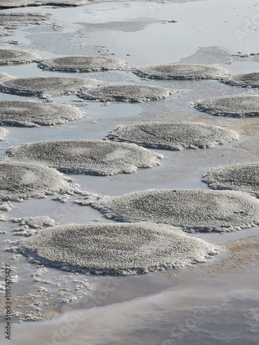 Billede på lærred Salt pans of Trapani, Sicily, Italy, showcasing circular salt formations surroun