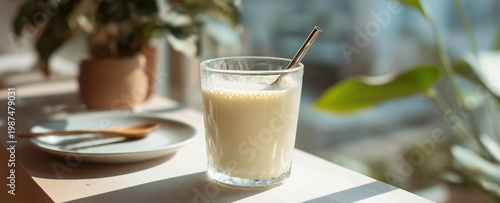 Making and drinking soy milk for health minimalist cafe scene with soy milk drink served in aesthetic glass modern lifestyle