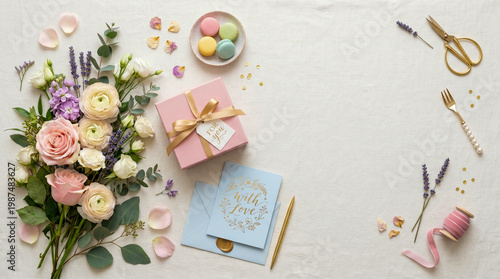 Flat lay composition with flowers, gift box, card and pastel decorations, clean top view, commercial stock style, copy space