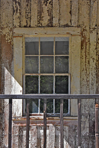 Weathered peeling window wall and railing 